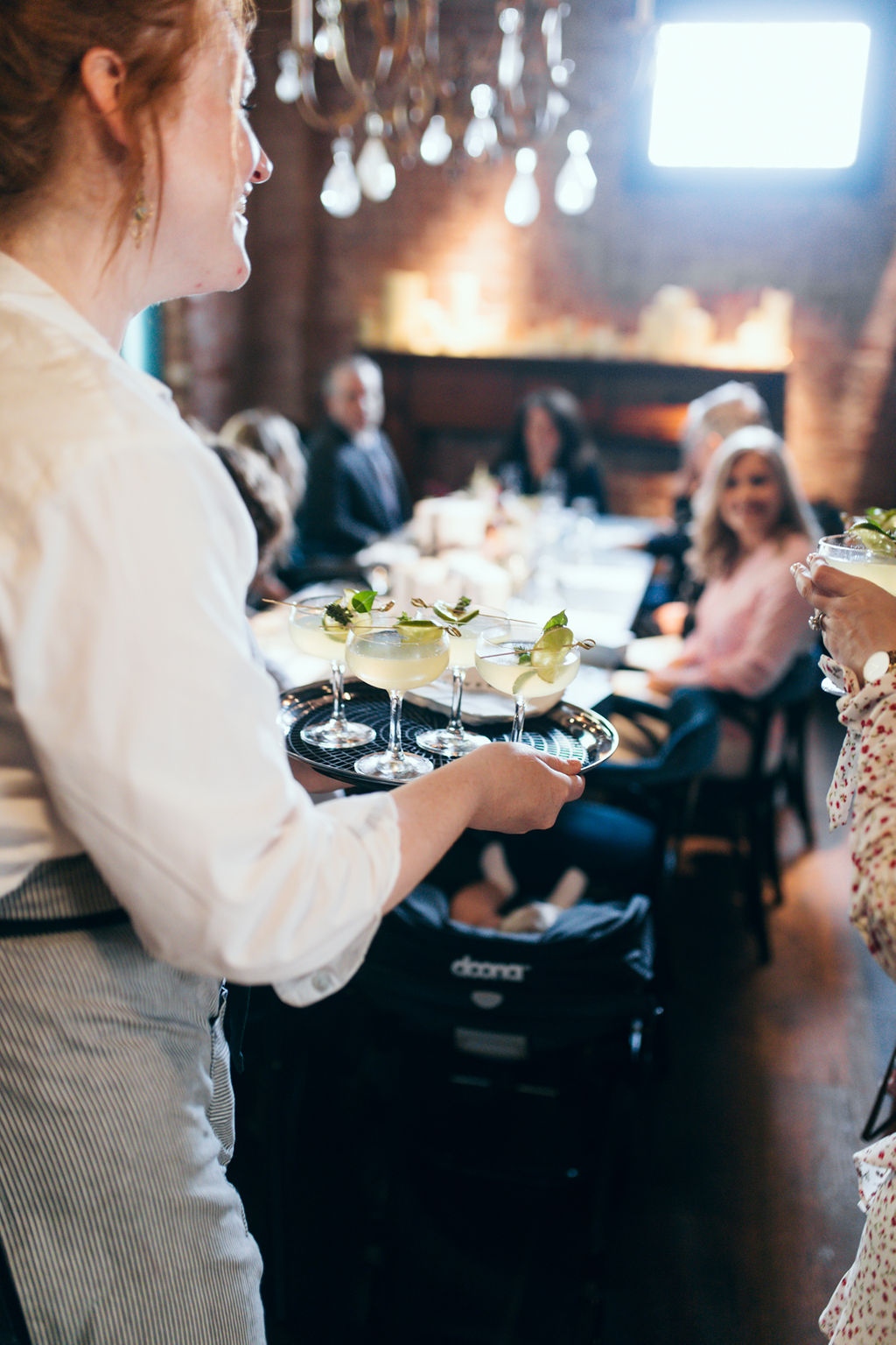 Waitress serving wedding party at Maverick